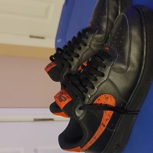 Black and red Nike Air force 1s. AF1